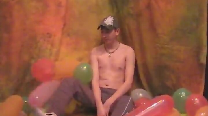 Twink with long brunette hair.