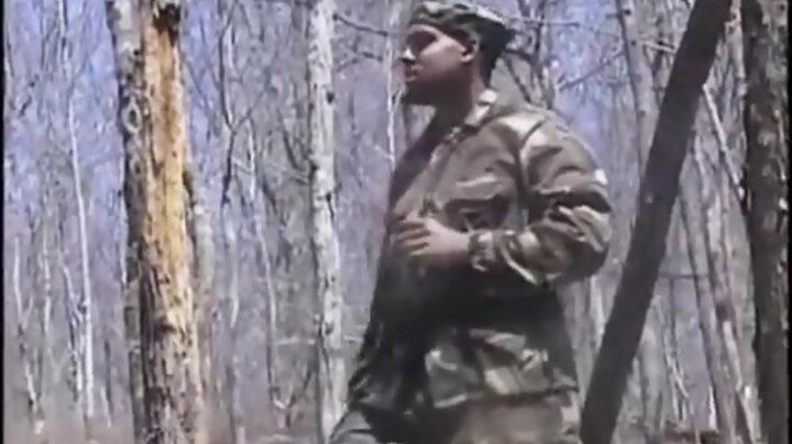 Soldier strokes dick in forest